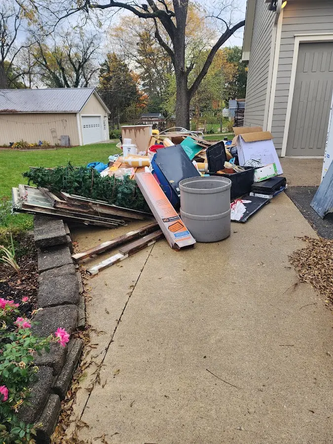 Dumpster being loaded with debris for 10 Yard Dumpster Rental in Wilkesboro